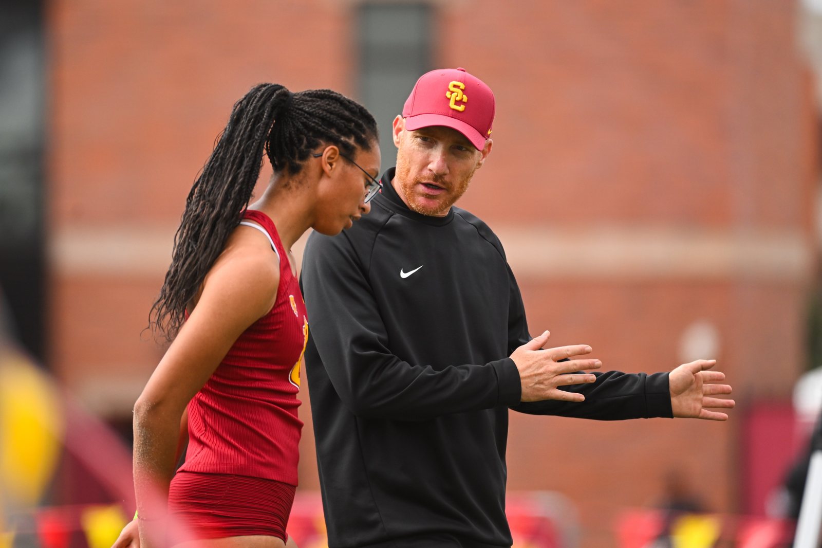 Jeff Petersmeyer coaching a USC jumper trackside
